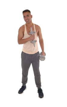 A handsome east Indian man standing in track pants working with.two dumbbells, isolated for white background.