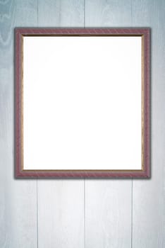 Photo or painting frame on wooden background.