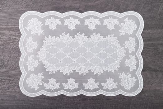 Retro place mat on wooden deck table.