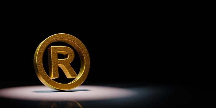Golden Trademark Symbol Shape Spotlighted on Black Background with Copy Space 3D Illustration