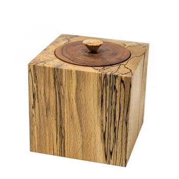 Bright wooden box in cube shape made of beech wood with lid isolated on white