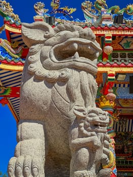Chinese Lion Figurine, stone sculpture in front of Chinese temple