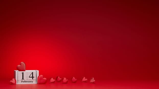 Group of silk red hearts, calendar with date 14 february on red background. Valentine's Day card with copy space. Design element for romantic greeting card, invitation. Hearts background.