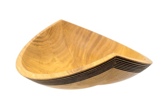 Hand-turned wooden bowl made of oak in the form of a ship isolated on white