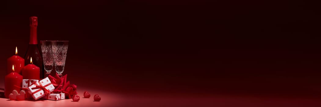 Red hearts, roses, gift boxes, champagne bottle and flutes on dark background. Copy space. Valentine's Day. Wedding Day. For romantic greeting card, invitation. Extra wide panorama banner background