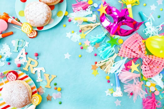 Cheerful decorations and party garlands on a blue background