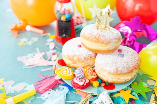 Delicious jam-filled donuts and colorful candies and sweets