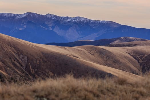 mountain landscape in Fagaras Mountains, Romania. In background Iezer Mountains