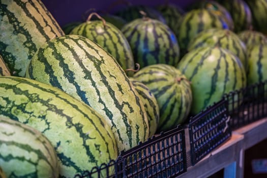 Huge watermelons for sale in a fruit and vegetable shop on the street in Zigong, China