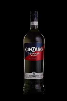 St.Petersburg, Russia - December 2019 -  Bottle of Italian vermouth Cinzano Bianco on black background. Authentic Italian tradition