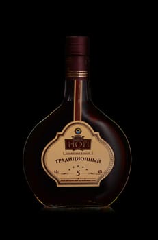 St.Petersburg, Russia - December 2019 - Bottle of NOY traditional Armenian cognac on black background. Five-year aging. Brand of ‎Yerevan Ararat Brandy Factory