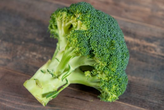 organic broccoli on the wooden background