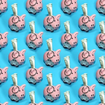 Seamless abstract business background with pink money piggy banks on a blue background