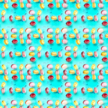 Abstract seamless pattern with flying colored macaroons, holiday concept