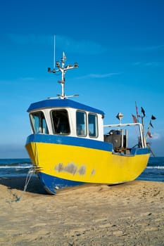 Fishing boat on the beach of the Polish Baltic coast near Rewal