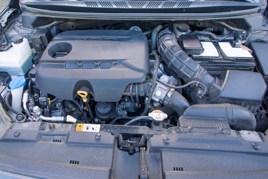 The engine and all the other parts of the car under the hood. Diesel engine from a famous car manufacturer.