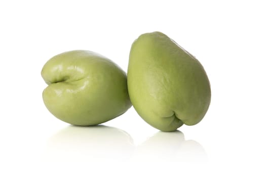 Fresh whole chayote squash isolated on a white background.