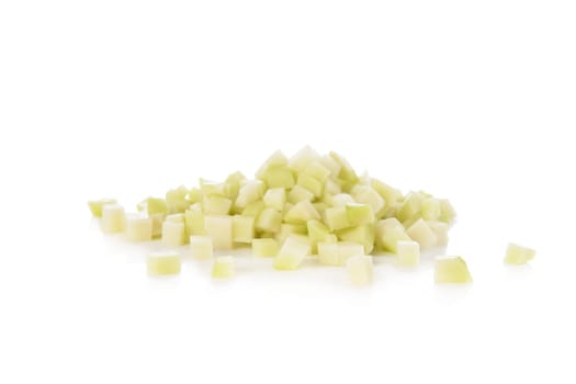 Fresh cubed chayote squash isolated on a white background.