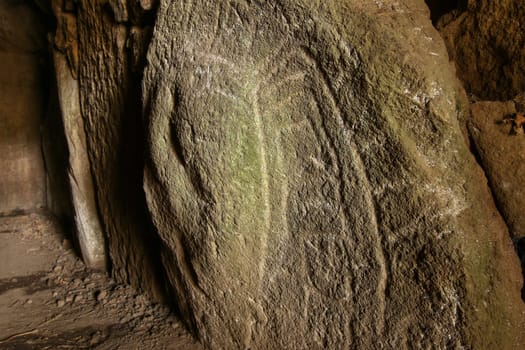 Mysterious shapes carved on a stone in one of the dolmens Mane Kerioned, Carnac, Brittany, France