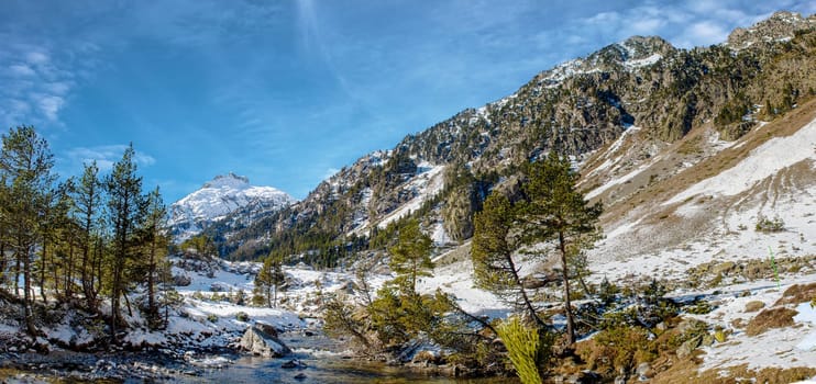 small river in the snowy Pyrenees mountains, near Pont Espagne