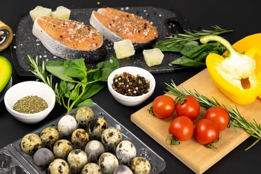A set of healthy balanced super food, fresh salmon, vegetables, cereals on a black background. Top view, flat lay with copy space