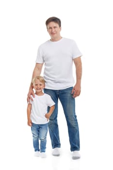 Friendly family. Young man with child stands isolated on a white background. Happy parent. Father with son. Concept of people and family