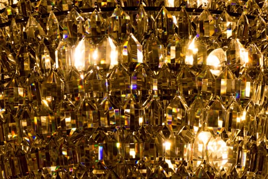 Noble candelabra hanging on ceiling with lots of little gems. Wealth decoration for palace gala, villa business meeting or wedding.