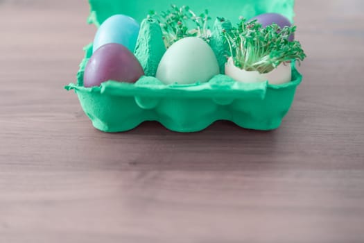 Beautiful decoration easternest basket with painted eggshells for celebration. Lovely traditional gift design on wooden background.