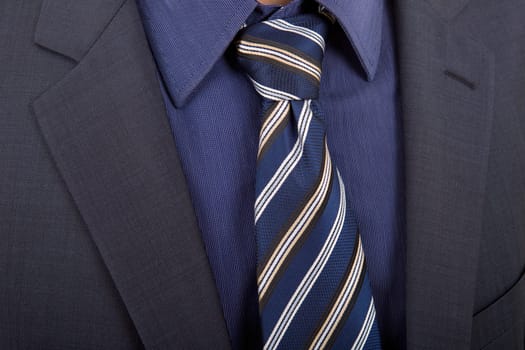 detail of a business man suit with blue tie
