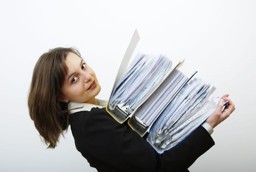 Young attractive business woman overloaded with heavy files
