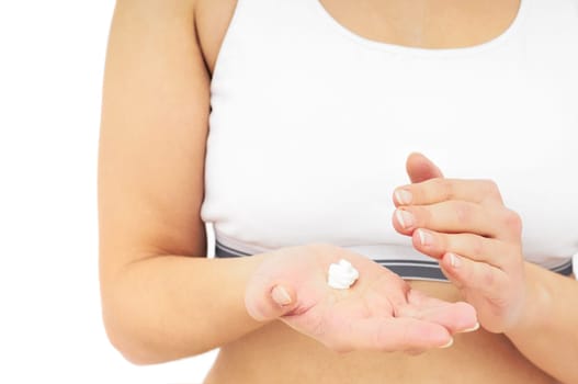 Woman in underwear applies cream on dry hands