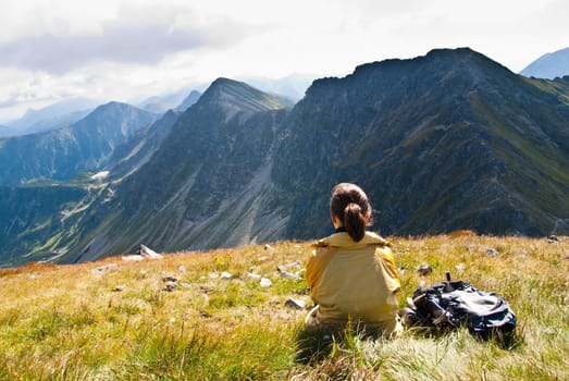 Young person relaxes on hiking in mountains (East Tatras, Slovakia, central Europe)
