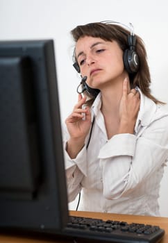 Young business person with neck pain working at computer