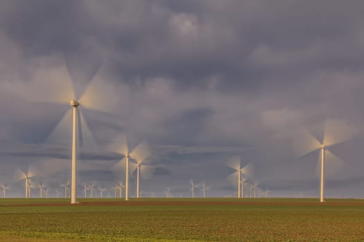 wind power turbines on a hill in morning. Dobrogea, Romania
