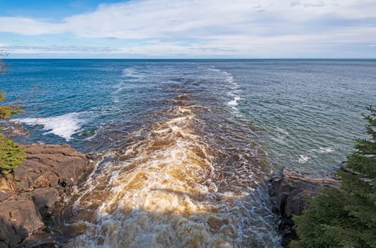 Dark Waters emptying into a Blue Lake with the Cascade River and Lake Superior