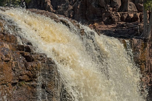 Water Pouring Over the Brink on Lower Gooseberry Falls in Minnesota
