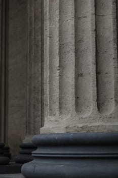 ancient Corinthian column on round base close up