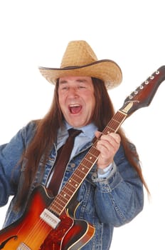 A handsome indigenous man in a jeans jacket and a cowboy hat.standing and playing the guitar, isolated for white background.