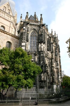 Side view of a church, with statues on the façade