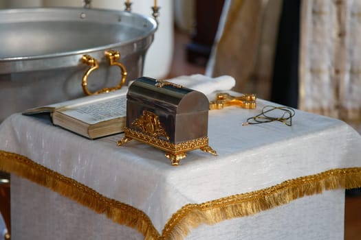 Church Baptism SuppliesChurch supplies priest for baptism on the table