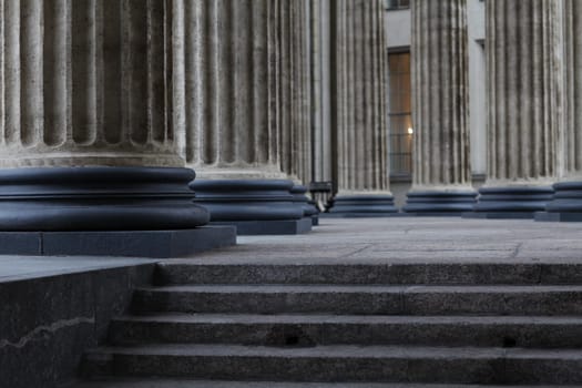 Stairs to the colonnade, classical Corinthian column older close up