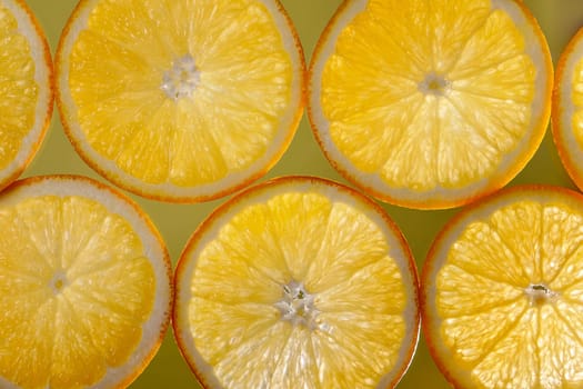 Background from slices of orange to the lumen, yellow orange