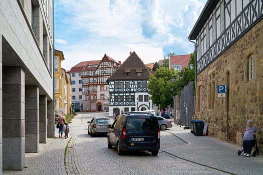 Road traffic in the old town of Eisenach. In the middle of the picture is the Luther House.