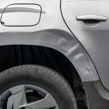 Accident on the side of the car. Dents on the car caused by the accident.