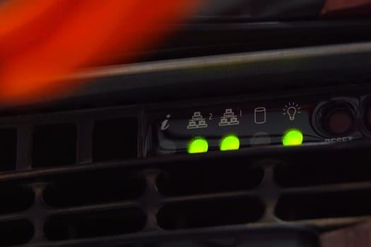 A working server. Internet wires and flashing lights on the server.