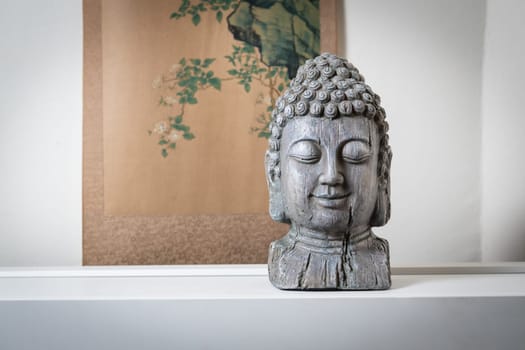 a sculpture of Buddah face for spiritual and zen ambiant