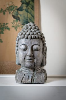 a sculpture of Buddah face for spiritual and zen ambiant