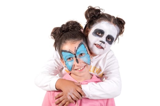 Girls with animal face-paint isolated in white