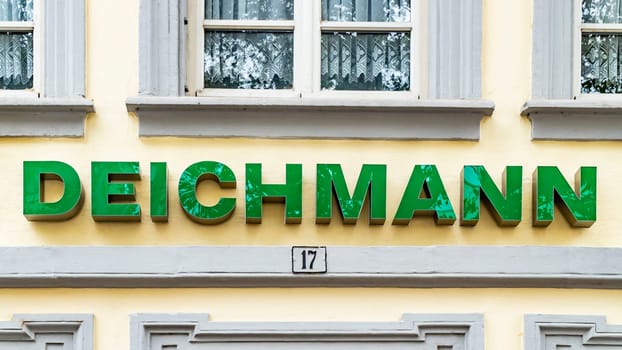 TRIER, GERMANY - SEPTEMBER 13, 2019: Deichmann store of international chain of mass fashion retail footwear stores brand logo at its building located in TRIER shopping area Germany.