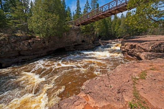 Bridge Spanning a Dramatic Cascade of the Gooseberry River in Gooseberry River State Park in Minnesota